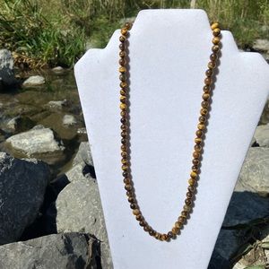 Tiger eye women stringed stone necklace, 23’ length, barbell clasp. Used